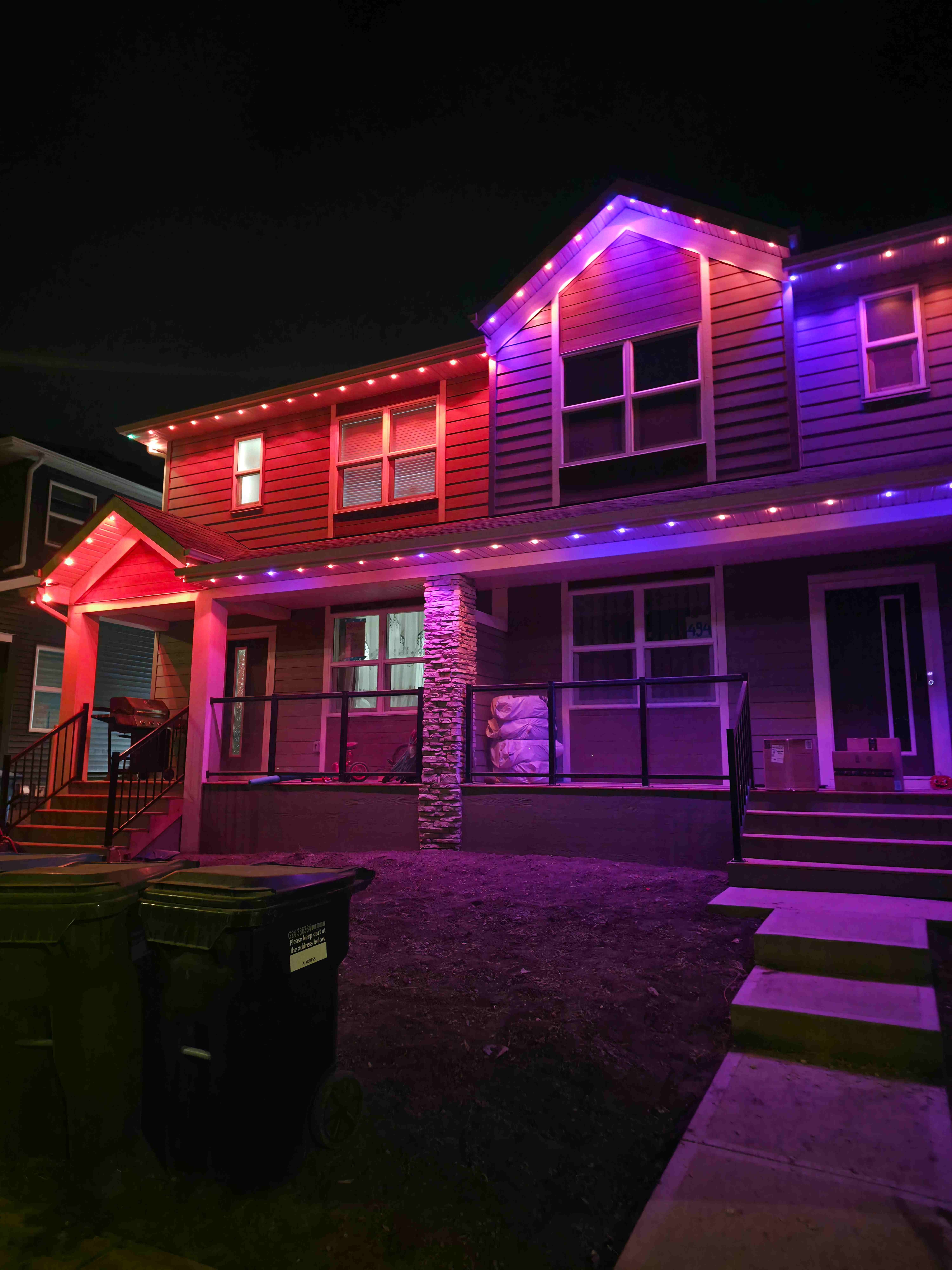 Home lit in a red-to-purple-to-blue gradient across the rooflines